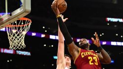 LOS ANGELES, CA - MARCH 19:  LeBron James #23 of the Cleveland Cavaliers attempts a layup over Ivica Zubac #40 of the Los Angeles Lakers at Staples Center on March 19, 2017 in Los Angeles, California.  NOTE TO USER: User expressly acknowledges and agrees that, by downloading and or using this photograph, User is consenting to the terms and conditions of the Getty Images License Agreement.  (Photo by Harry How/Getty Images)