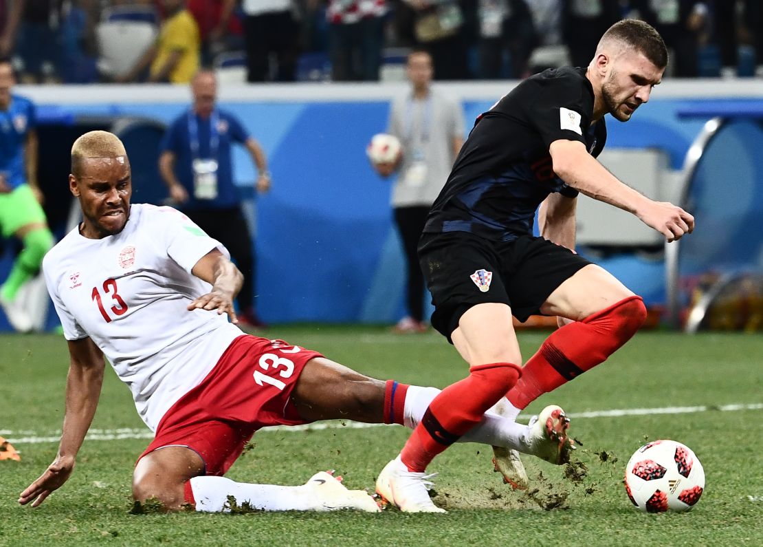 Denmark's defender Mathias Jorgensen fouls Croatia's forward Ante Rebic (R) to give away a late penalty.