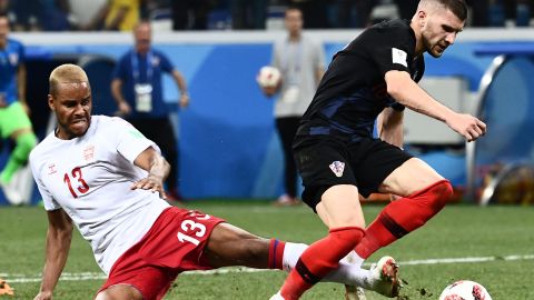 Denmark's defender Mathias Jorgensen fouls Croatia's forward Ante Rebic (R) to give away a late penalty.