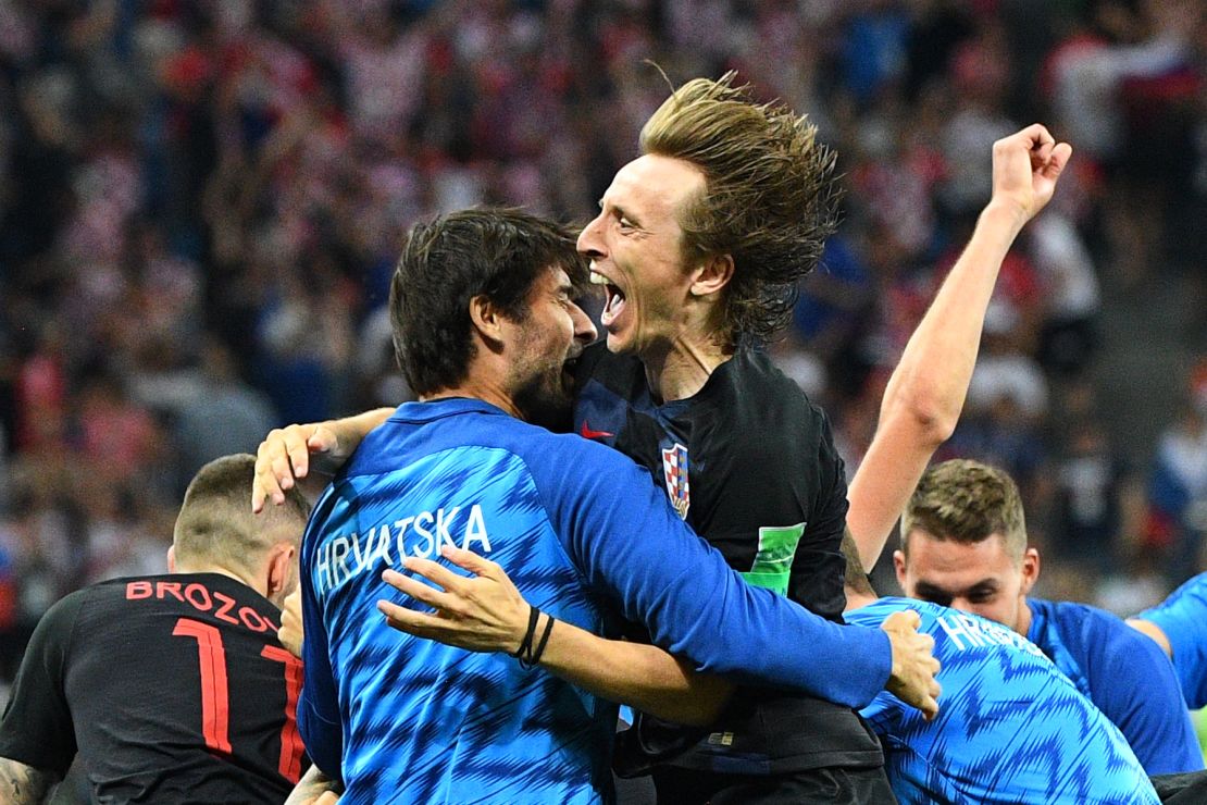 Croatia midfielder Luka Modric (top C) celebrates with teammates after Croatia defeated Denmark on penalties.