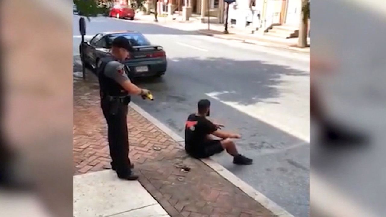 Cop Stun Guns Man Sitting On Sidewalk Cnn 3234