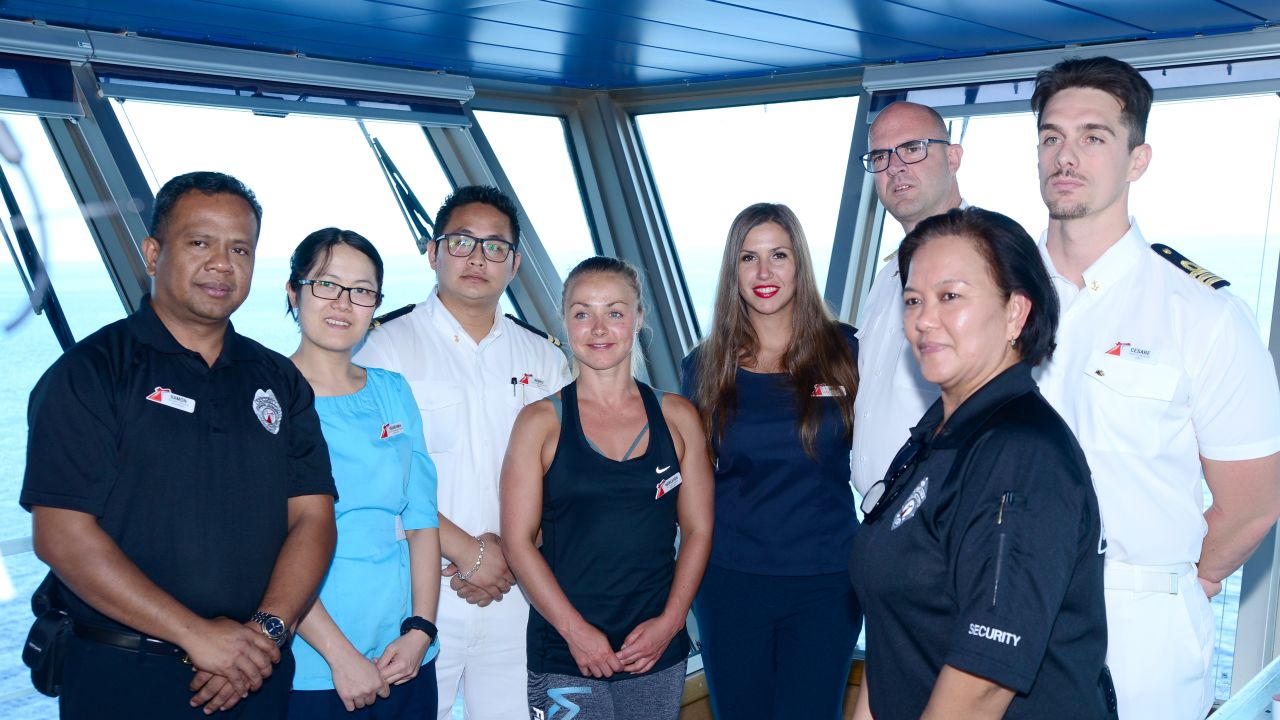 Crew members on Carnival Glory who played a role in the rescue at sea on Sunday of a Norwegian Cruise Line crew member. From left to right: Securitay Guard Ramon Morales; Assistant Stateroom Steward Ni Puti Kharisma Dew Wiryanari; Assitance Chief Security Rishu Thapa; Playlist Dancer Karleigh Wright; Assistant Shore Excursion Manager Maja Krstic; Captain Pero Grubješić; Safety Officer Cesare Mattera and Security Guard Irma Caldino Mariscotes.
