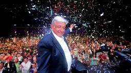 Newly elected Mexico's President Andres Manuel Lopez Obrador (C), running for "Juntos haremos historia" party, cheers his supporters at the Zocalo Square after winning general elections, in Mexico City, on July 1, 2018. (Photo by PEDRO PARDO / AFP)        (Photo credit should read PEDRO PARDO/AFP/Getty Images)