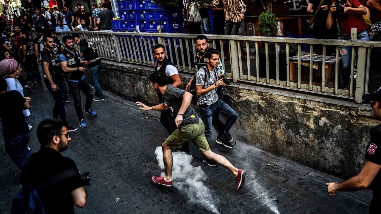Police disperse campaigners during Sunday's parade.