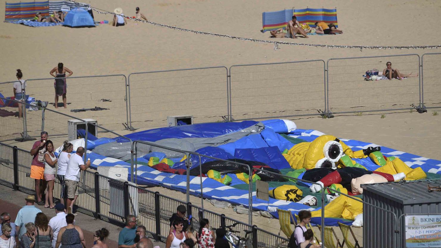 Witnesses say a bouncy castle exploded and threw a girl from it Sunday in eastern England.