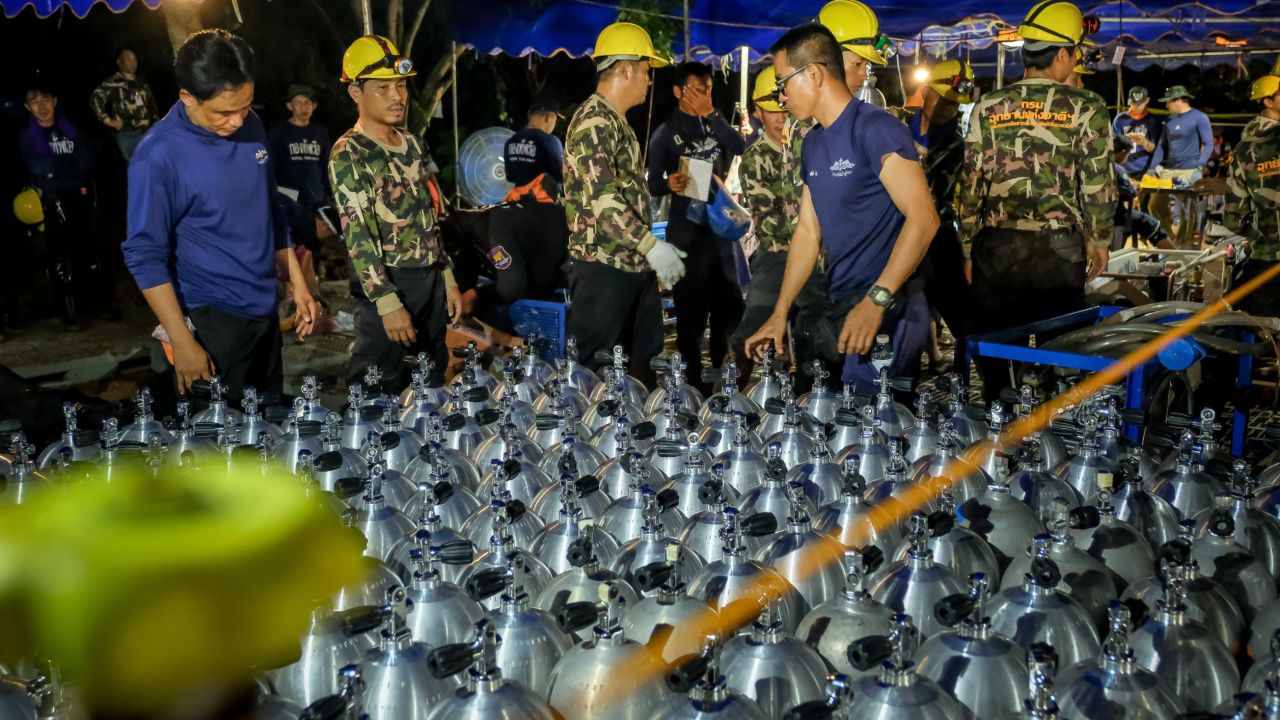 Scuba tanks are delivered to the site to aid rescue efforts.