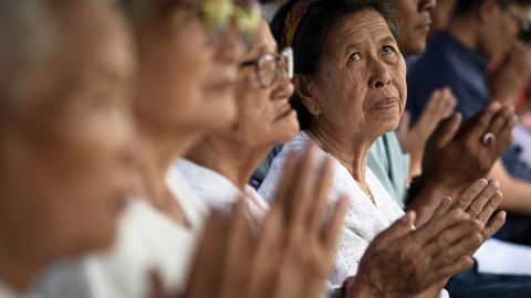 Local women attend a Buddhist prayer for the missing children at a local school.