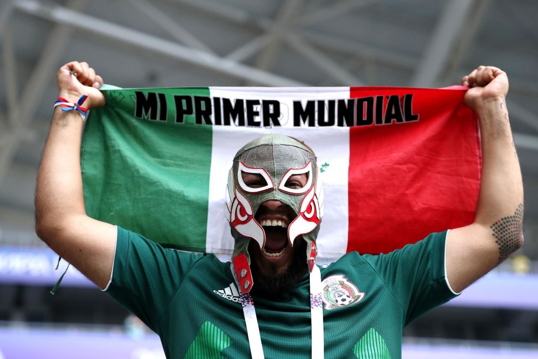 A Mexico fan watches on as his country plays Brazil.