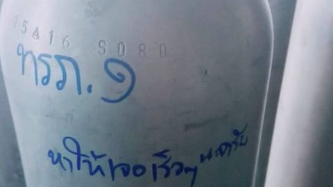 A metal scuba tank with the words: "Please find them soon."