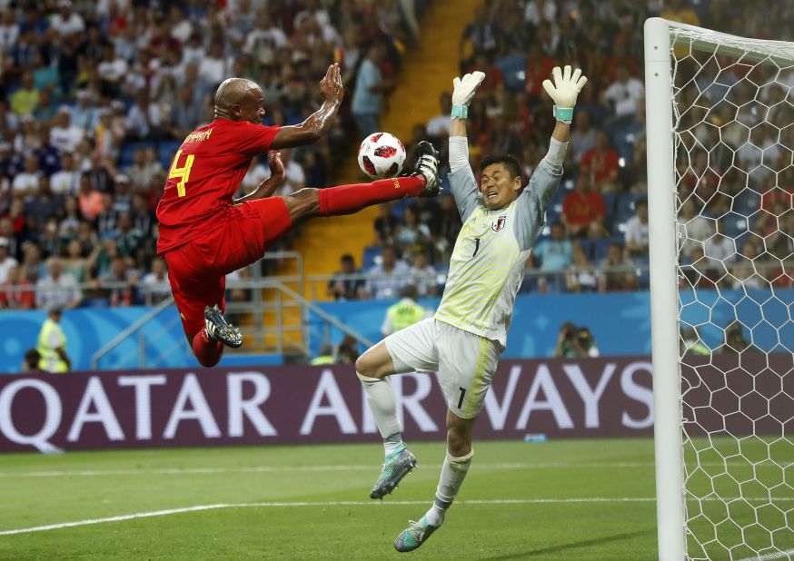 Belgium defender Vincent Kompany nearly scores in the first half.