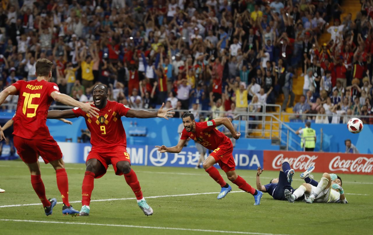 Belgium players celebrate after Nacer Chadli, third from right, scored with just seconds remaining to win the round-of-16 match against Japan on July 2.
