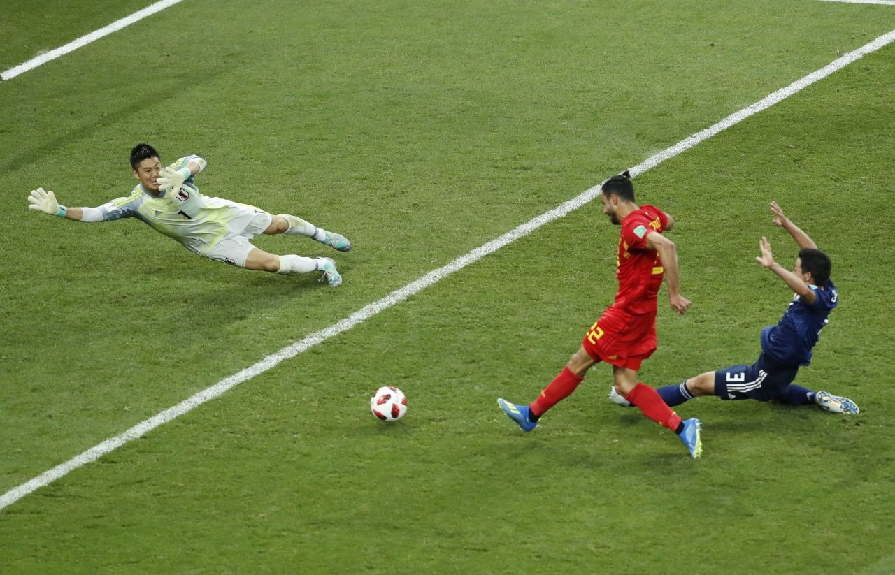 Chadli slides the ball past Japan goalkeeper Eiji Kawashima to finish off Belgium's 3-2 comeback victory. It is the first time since 1970 that a team has come back from two goals down to win in the World Cup knockout stage. 