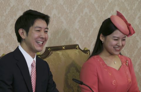 Japanese Princess Ayako, the third daughter of the late Prince Takamado, and her fiancé Kei Moriya attend a news conference to announce their engagement at the Imperial Household Agency in Tokyo on July 2, 2018. 