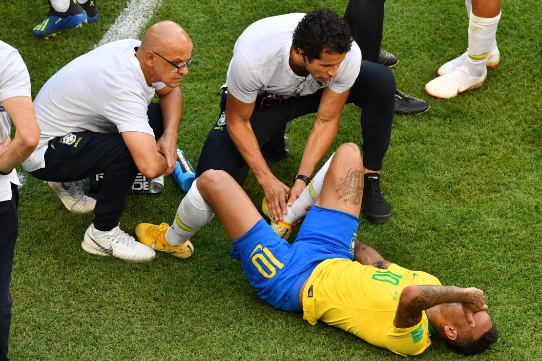 Neymar receiving treatment on the pitch.
