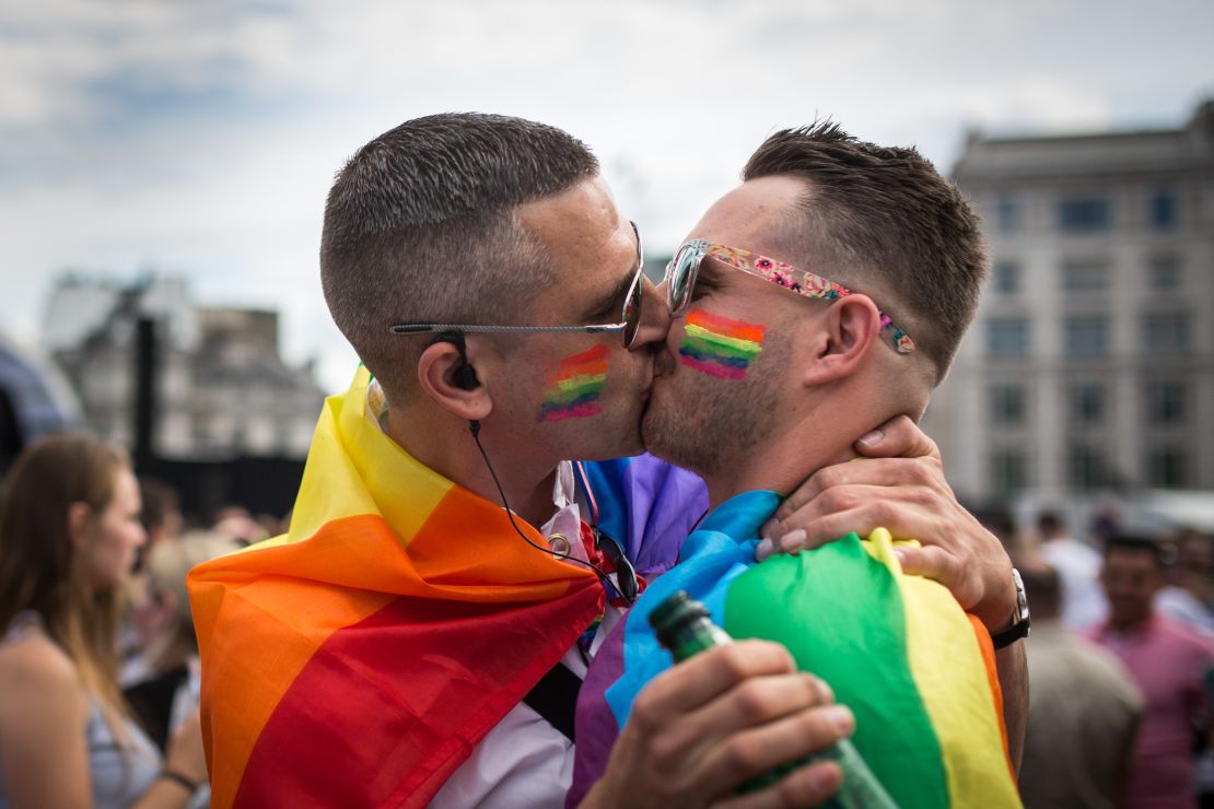 A couple kiss during London's annual Pride Parade, which has been canceled this year due to the coronavirus pandemic.