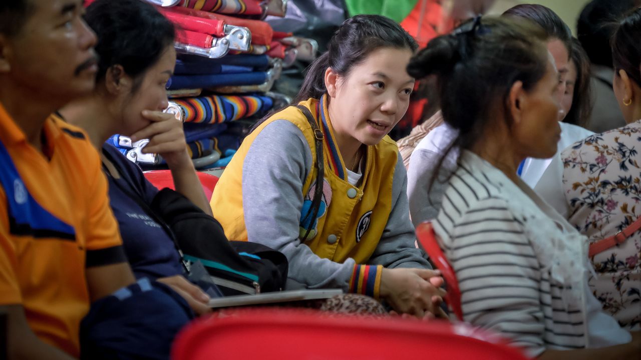Relatives of the stranded children and their coach gather at Khun Nam Nang Non Forest Park to hear updated news on the rescuse efforts on Tuesday morning.