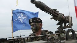 ZAGAN, POLAND - JUNE 18:  A soldier of the Polish Army sits in a tank as a NATO flag flies behind during the NATO Noble Jump military exercises of the VJTF forces on June 18, 2015 in Zagan, Poland. The VJTF, the Very High Readiness Joint Task Force, is NATO's response to Russia's annexation of Crimea and the conflict in eastern Ukraine. Troops from Germany, Norway, Belgium, Poland, Czech Republic, Lithuania and Belgium were among those taking part today.  (Photo by Sean Gallup/Getty Images)