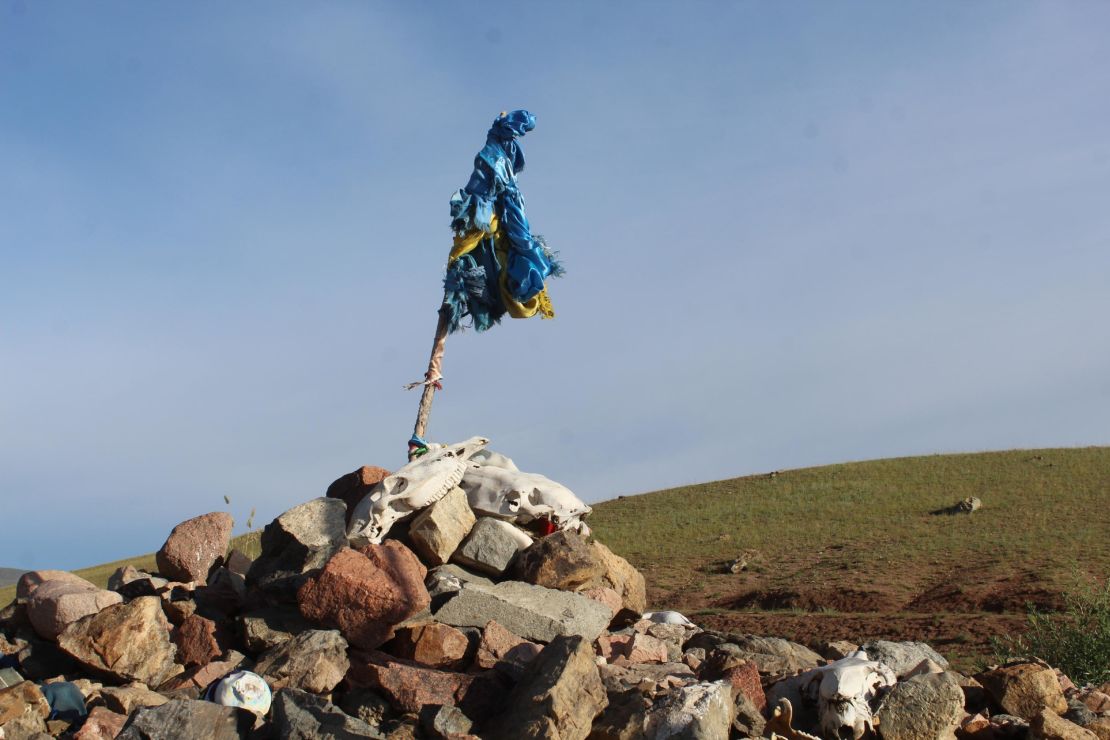 Horse skulls sit atop an ovoo, or ritual stone cairn, outside the city of Murun in Mongolia.