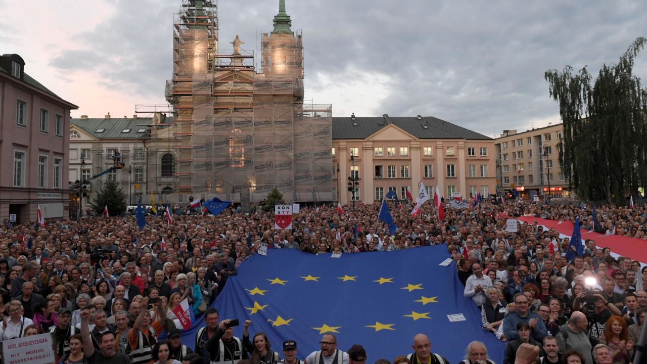 Protestors shout slogans and wave flags as they attend a demonstration in support of Supreme Court judges in front of The Supreme Court in Warsaw on July 3, 2018. - Poland's Chief Justice Malgorzata Gersdorf has refused to step down, defying a controversial new law by the right-wing government which requires her and other senior judges to retire early. Janek Skarzynski/AFP/Getty Images