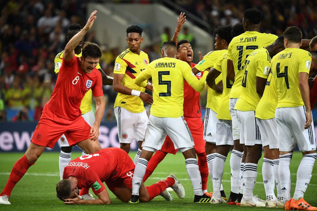 Henderson falls to the ground after being hit by Barrios.