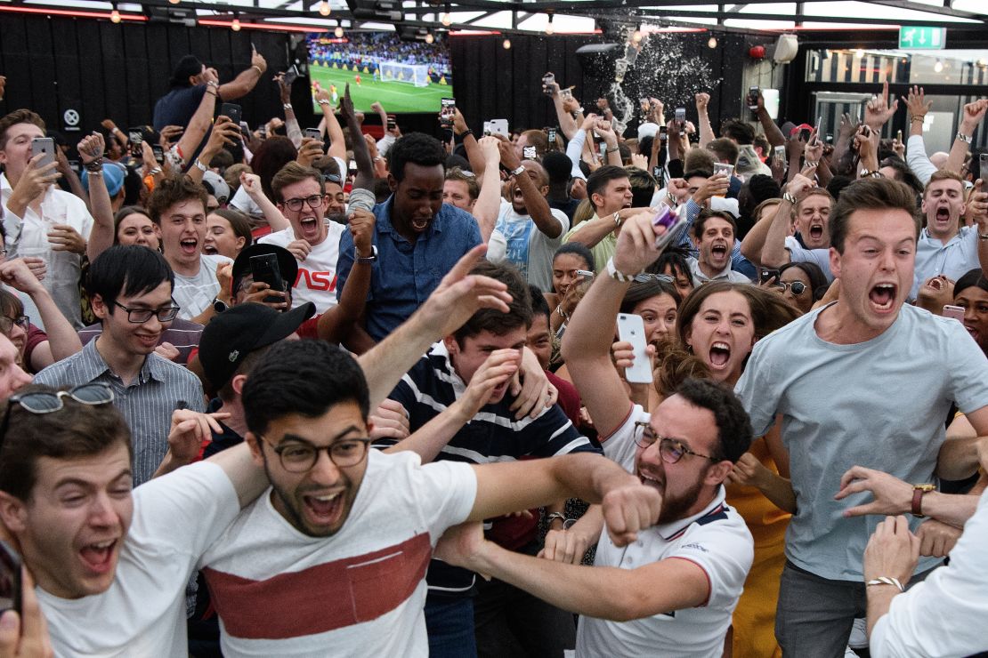 Pints are thrown, limbs go flying and screams are deafening as fans in London, England celebrate their team reaching the last eight of the World Cup. 