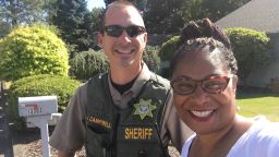 Rep. Janelle Bynum smiles with the officer that was dispatched when a woman called the police on her.