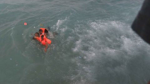 Ferry passengers were pulled onto passing boats.