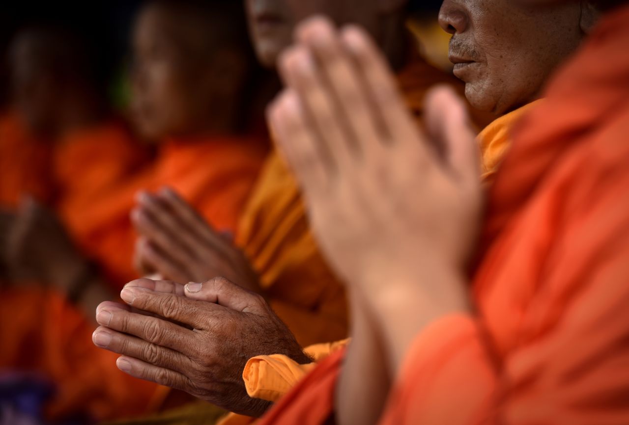 Monks attend a Buddhist prayer for the team on July 1.