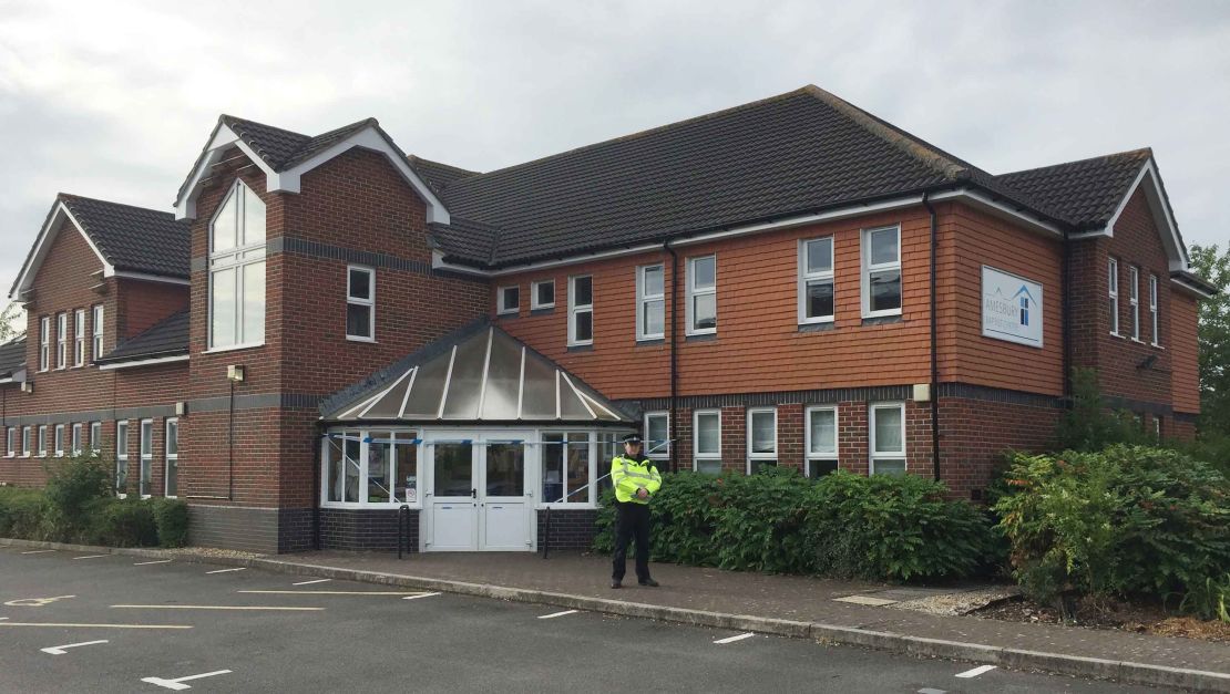 A police officer stands outside the Amesbury Baptist Church in Wiltshire.