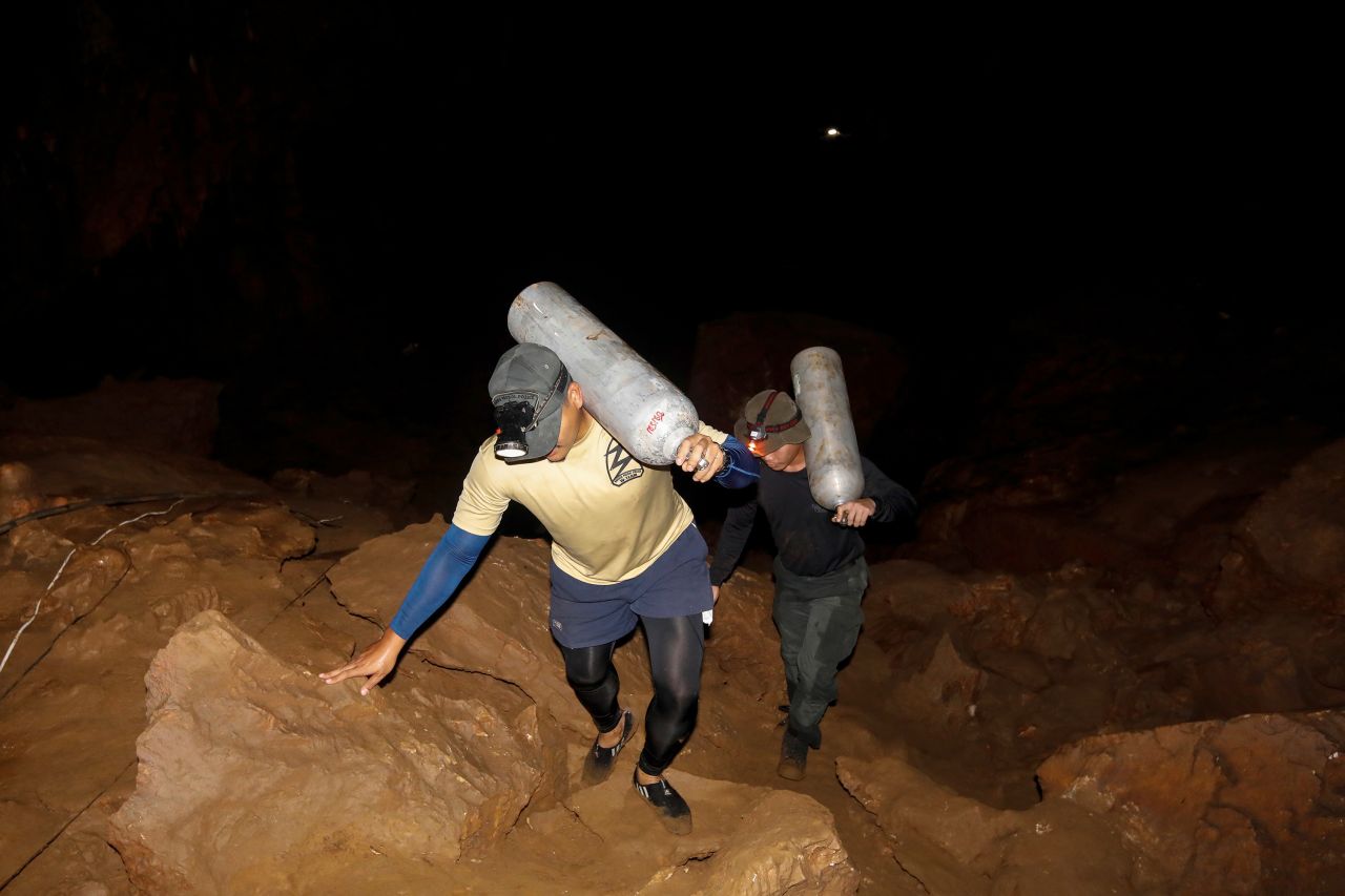 Rescuers search the cave on June 26.