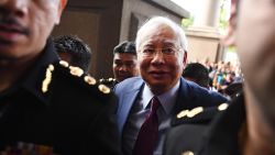 Former Malaysian prime minister Najib Razak (C) arrives for a court appearance at the Duta court complex in Kuala Lumpur on July 4, 2018. - Najib, 64, was detained on July 3 as the government of Prime Minister Mahathir Mohamad intensified a probe on corruption during his rule, including the alleged siphoning off of billions of dollars from state fund 1MDB. (Photo by MOHD RASFAN / AFP)        (Photo credit should read MOHD RASFAN/AFP/Getty Images)