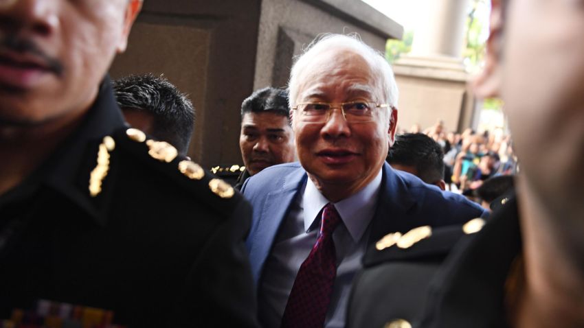 Former Malaysian prime minister Najib Razak (C) arrives for a court appearance at the Duta court complex in Kuala Lumpur on July 4, 2018. - Najib, 64, was detained on July 3 as the government of Prime Minister Mahathir Mohamad intensified a probe on corruption during his rule, including the alleged siphoning off of billions of dollars from state fund 1MDB. (Photo by MOHD RASFAN / AFP) (Photo credit should read MOHD RASFAN/AFP/Getty Images)