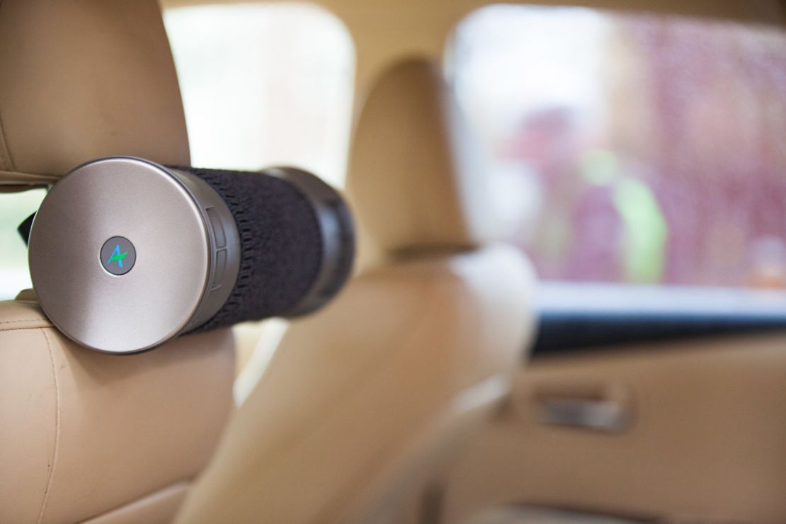 The Airbubbl filter attaches to a car's headrest.