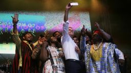 French President Emmanuel Macron, center, takes a selfie with Nigeria Nollywood Actors during an event to celebrate African Culture at the New Afrika Shrine in Lagos, Nigeria, Tuesday, July 3, 2018. Macron arrived Abuja earlier for a meeting with his Nigerian counterpart Muhammadu Buhari, in his latest attempt to forge closer ties with English-speaking Africa. Sunday Alamba/AP