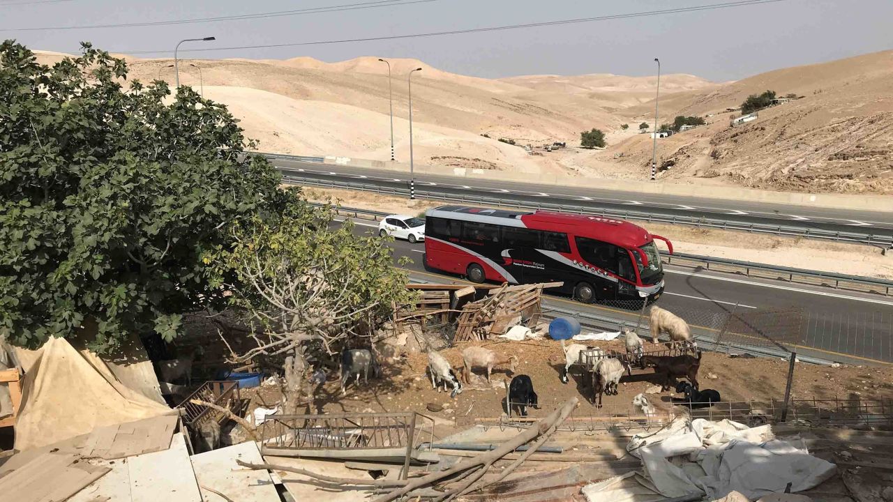 A four-lane highway connecting Jerusalem to the Dead Sea runs past the village.