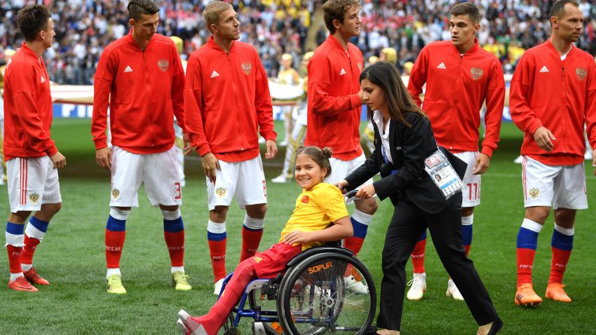MOSCOW, RUSSIA - JUNE 14: A young fan in her wheelchair is all smiles during the nation anthems prior to the 2018 FIFA World Cup Russia Group A match between Russia and Saudi Arabia at Luzhniki Stadium on June 14, 2018 in Moscow, Russia. (Photo by Matthias Hangst/Getty Images)