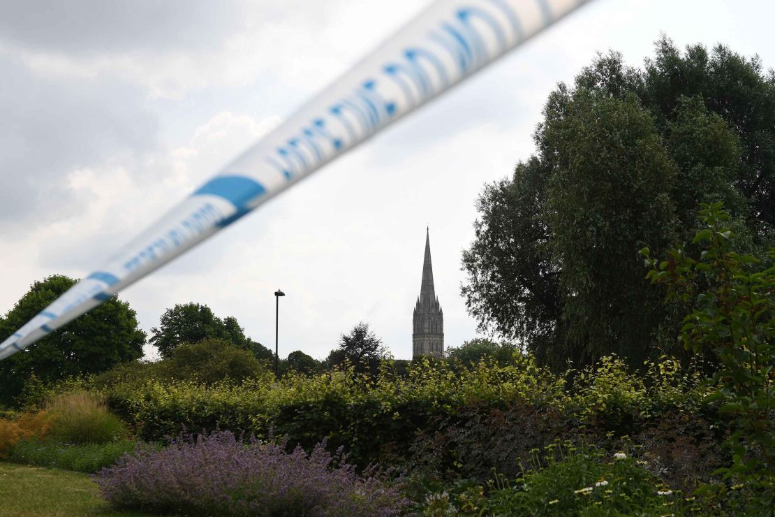 The spire of Salisbury Cathedral is seen behind police tape cordoning off Queen Elizabeth Gardens in Salisbury on Thursday.