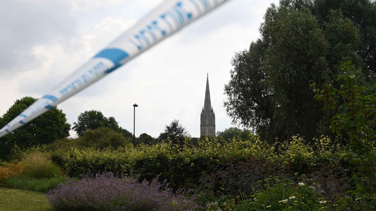 The spire of Salisbury Cathedral is seen behind police tape cordoning off Queen Elizabeth Gardens in Salisbury on Thursday.