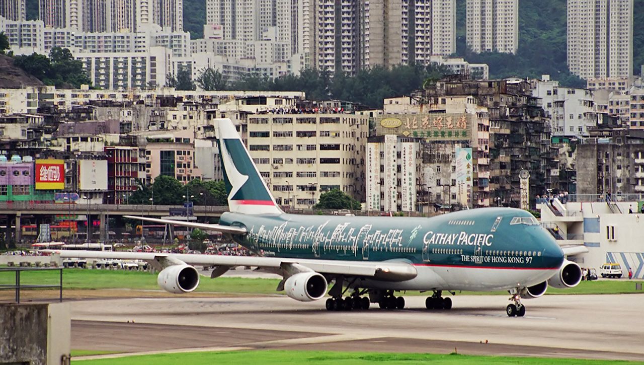 <strong>Cathay Pacific Airways at Kai Tak:</strong> Hong Kong-based Cathay Pacific Airways began operations in 1946, before the plan for Kai Tak expansion and the promontory into Kowloon Bay was approved in 1954. (The first recorded flight from the site took place in 1925.) Cathay was the last carrier to take off from the airport in 1998.