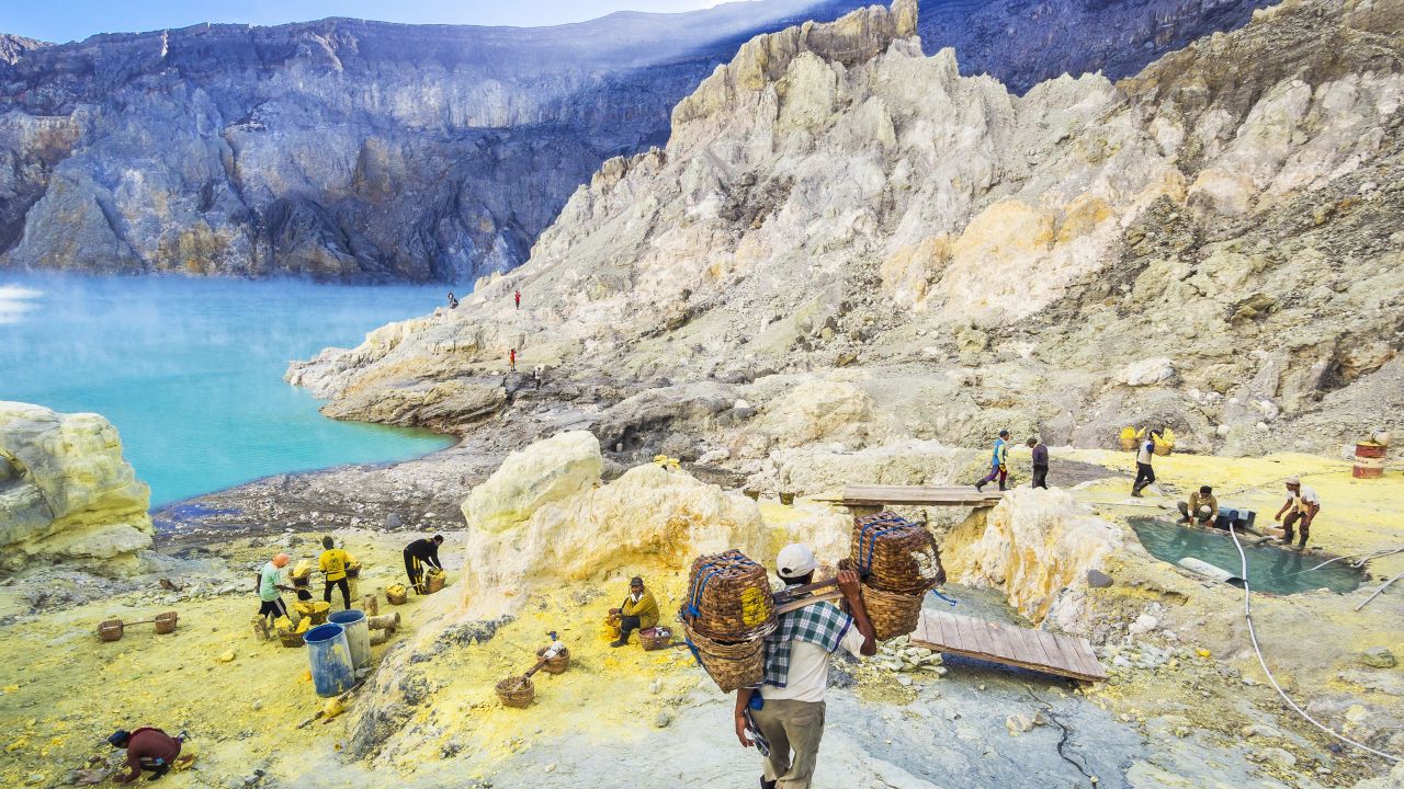 <strong>Kawah Ijen, Indonesia:</strong> Here, you can watch sulfur miners gather what they call "the devil's gold."