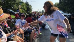 Democratic candidate Lucy McBath greets potential voters at an Independence Day parade.
