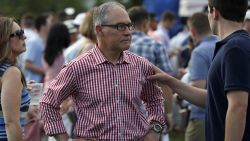 Environmental Protection Agency Administrator Scott Pruitt stands on the South Lawn during an afternoon picnic for military families at the White House, Wednesday, July 4, 2018, in Washington. (AP Photo/Alex Brandon)