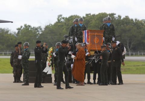 The body of Saman Kunan, a former Thai Navy SEAL, is carried during a repatriation and religious rites ceremony on July 6. Kunan died Friday as he returned from an operation to deliver oxygen tanks to the cave. He ran out of air while underwater, an official said.
