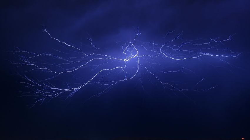 LAS VEGAS, NV - JULY 07:  Lightning strikes during a thunderstorm on July 7, 2015 in Las Vegas, Nevada. The monsoon storm dropped heavy rain and hail in parts of the valley causing street flooding and power outages.  (Photo by Ethan Miller/Getty Images)