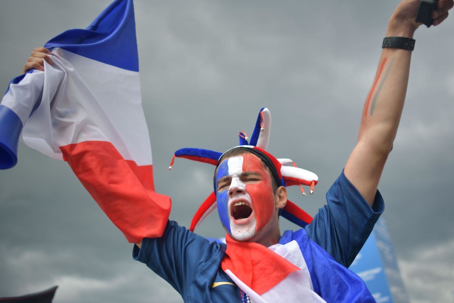 A France supporter cheers ahead of the match.