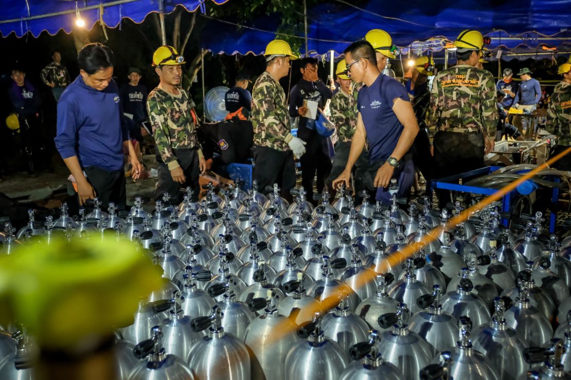 Scuba oxygen tanks being delivered to the cave rescue site on July 01, 2018. 