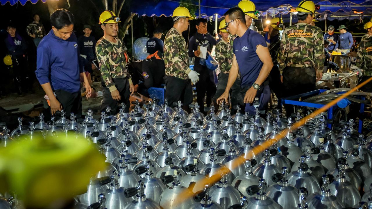 Scuba oxygen tanks are delivered to the cave rescue site on July 1.