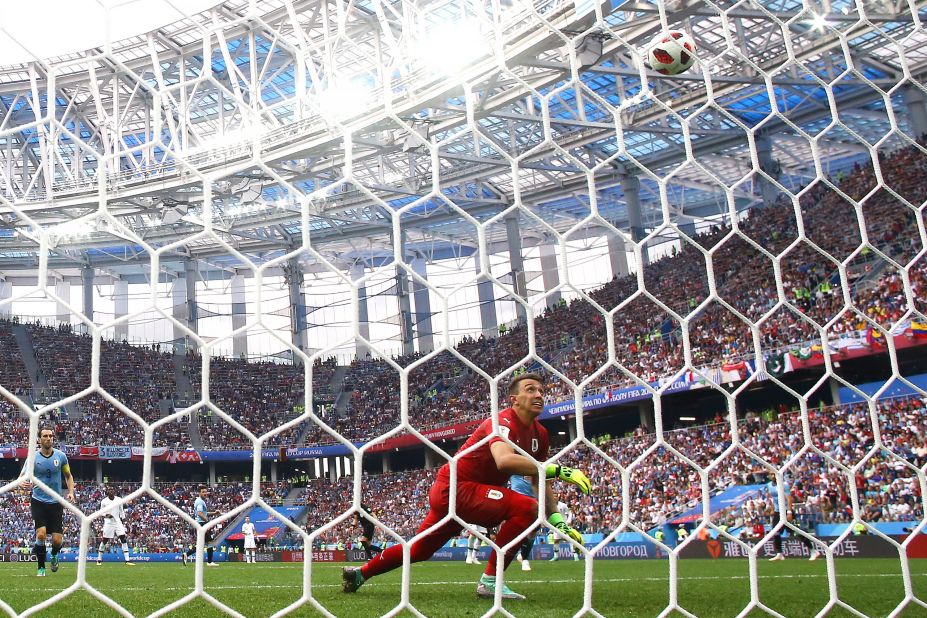 Uruguayan goalkeeper Fernando Muslera watches the ball leak into the net after he misplayed an Antoine Griezmann shot in the second half.
