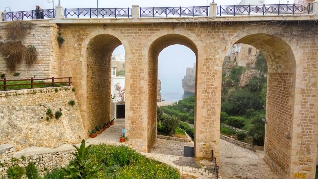 <strong>Bridge view:</strong> Polignano's main cove is flanked by a beautiful Bourbon-era bridge which offers great views of the waterfront and passes over a secluded entrance to the beach.