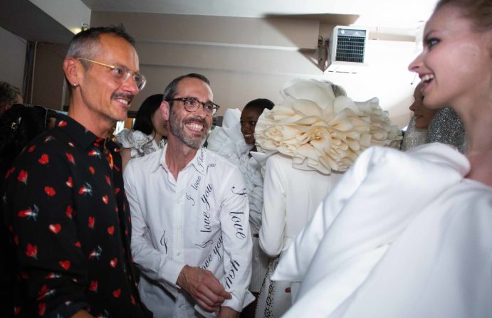 Horsting, left, and Snoeren greet a model backstage after the show. 